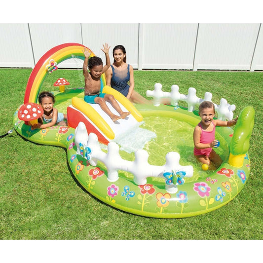 Children playing on a colorful inflatable playground set in a backyard.