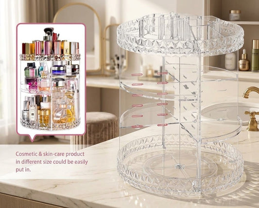 A clear acrylic rotating cosmetic organizer displayed on a bathroom counter, with an inset showing various skincare and perfume bottles stored inside. The background shows a softly blurred bathroom interior with a sink, mirror, and toiletries.