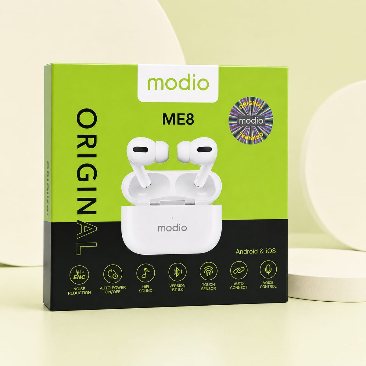 A box of modio ME8 Original true wireless earbuds, shown on a clean, light beige background with soft, abstract white shapes. The packaging is lime green and black, featuring a graphic of the white earbuds in their charging case.
