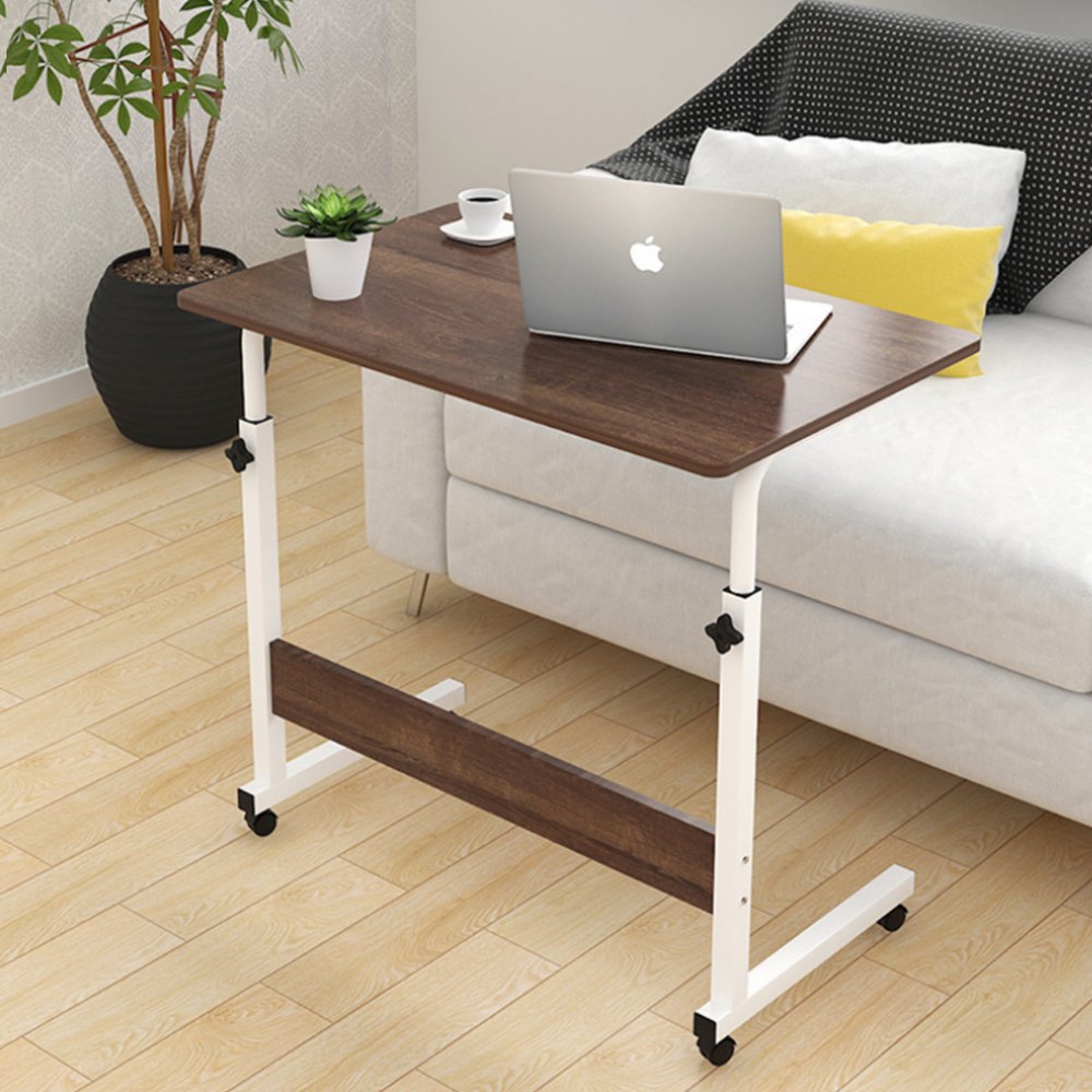 Laptop stand table with laptop and coffee cup living room setup