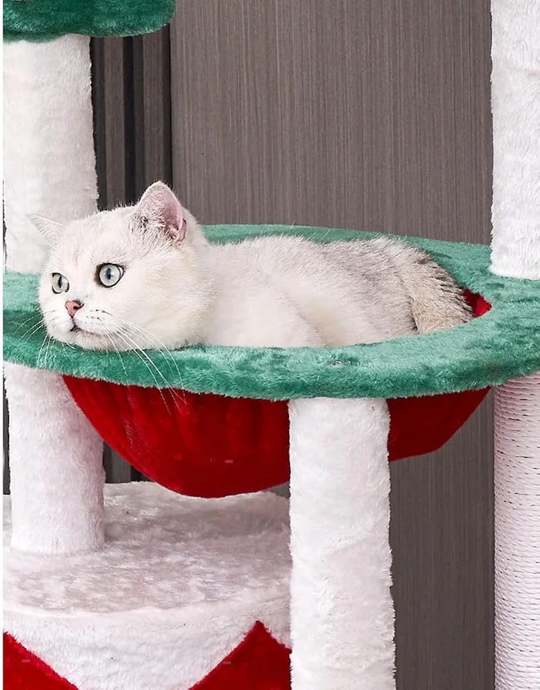 Cat resting on Christmas cat tree top platform Qatar