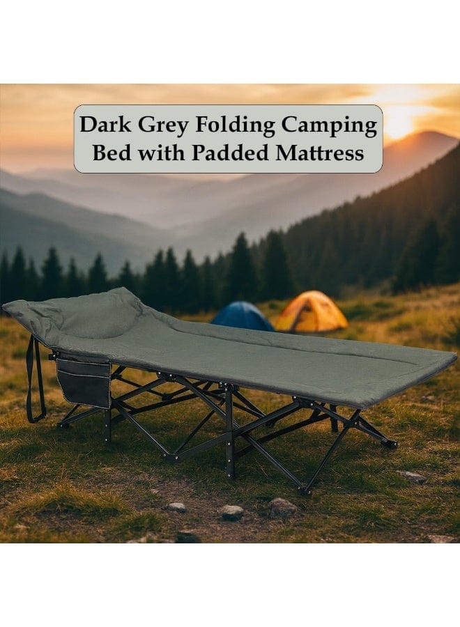 A dark grey folding camping bed with a padded mattress is shown set up in a grassy mountain campsite at sunset, with two tents in the background and a text overlay reading 'Dark Grey Folding Camping Bed with Padded Mattress'.