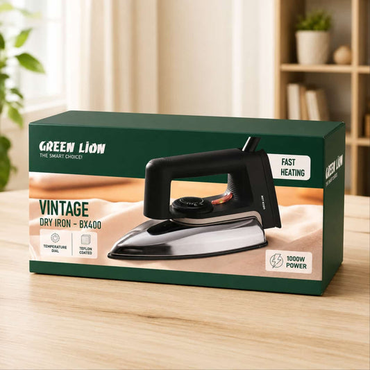 Green Lion Vintage Dry Iron BX400 retail packaging box displayed on a light wooden table, with a blurred home interior background.