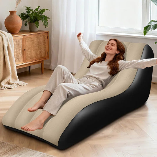 Woman relaxing on black and beige inflatable wave sofa chair in modern living room