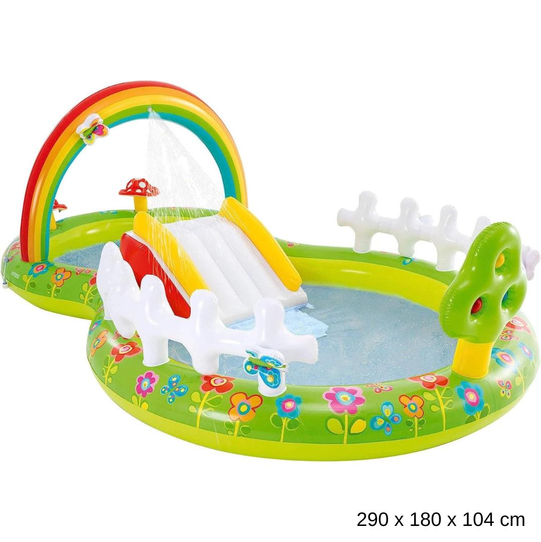 Intex My Garden inflatable play center with a rainbow arch sprinkler, water slide, and white fence boundaries.