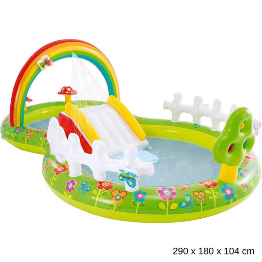 Intex My Garden inflatable play center with a rainbow arch sprinkler, water slide, and white fence boundaries.