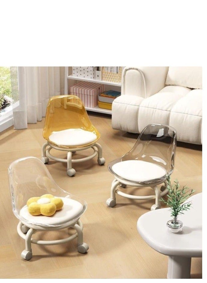 Three modern rolling accent chairs in a bright living room setting. One chair has a translucent amber-yellow seat and back, one has a clear translucent plastic seat, and one has a clear translucent plastic back with a white flower-shaped yellow cushion on the seat.