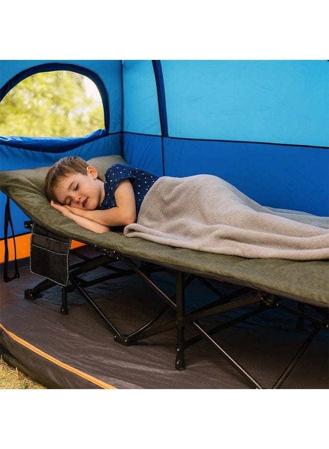 A child sleeping on a camping cot inside a blue tent, wrapped in a light beige blanket.