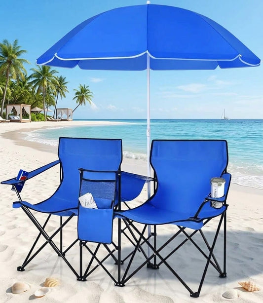 Portable double beach chairs with blue umbrella, cup holders, and folding frame on a sandy beach