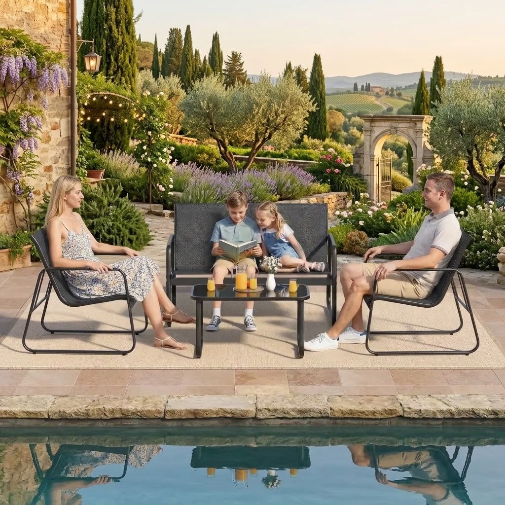 Black 4-piece outdoor patio furniture set with loveseat, two chairs and glass coffee table by a garden pool in Qatar