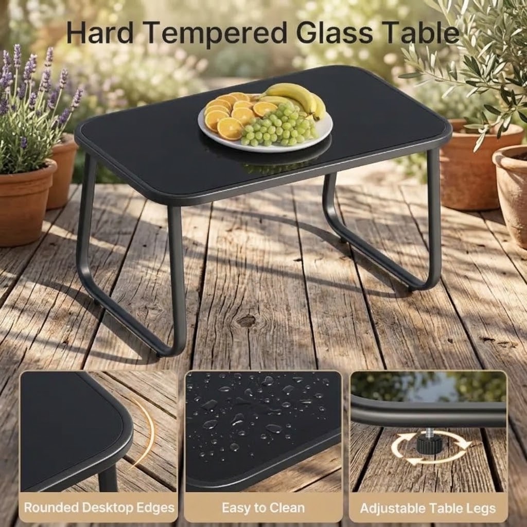 Black tempered glass outdoor coffee table with rounded edges and adjustable legs on a wooden deck